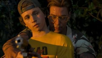 A man holds a gun and another person.