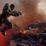 Marcus Fenix jumps over a gap.
