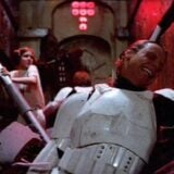 Star Wars characters are in a trash compactor.
