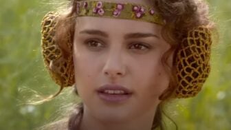Padme looks confused in a grassy field.