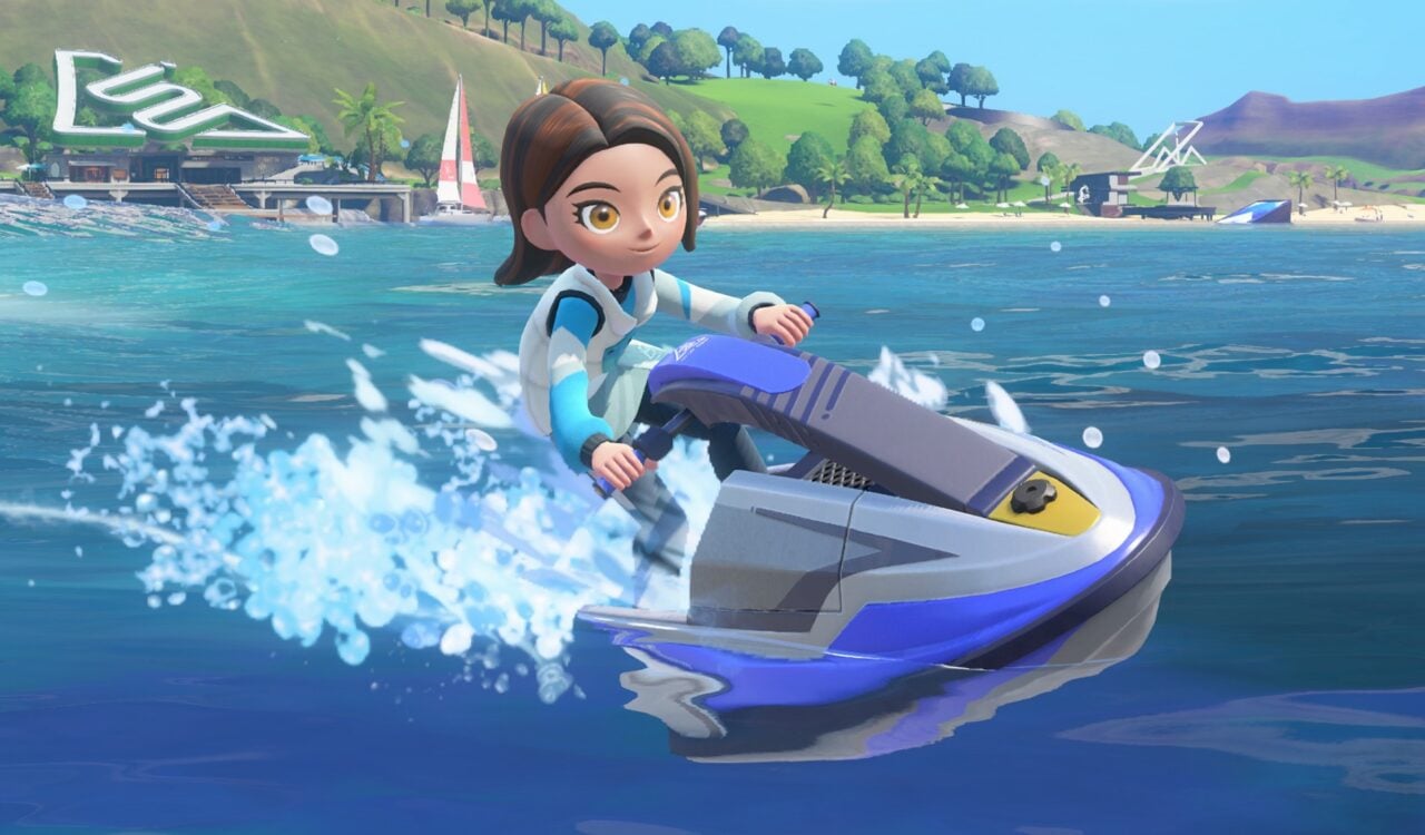 A woman jet skis over blue water.