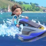 A woman jet skis over blue water.
