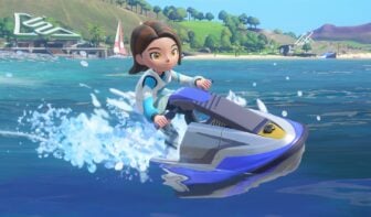 A woman jet skis over blue water.