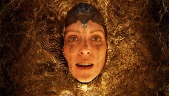 A woman appears in a gold mesh.