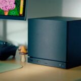 A Steam Machine sits on a desk.