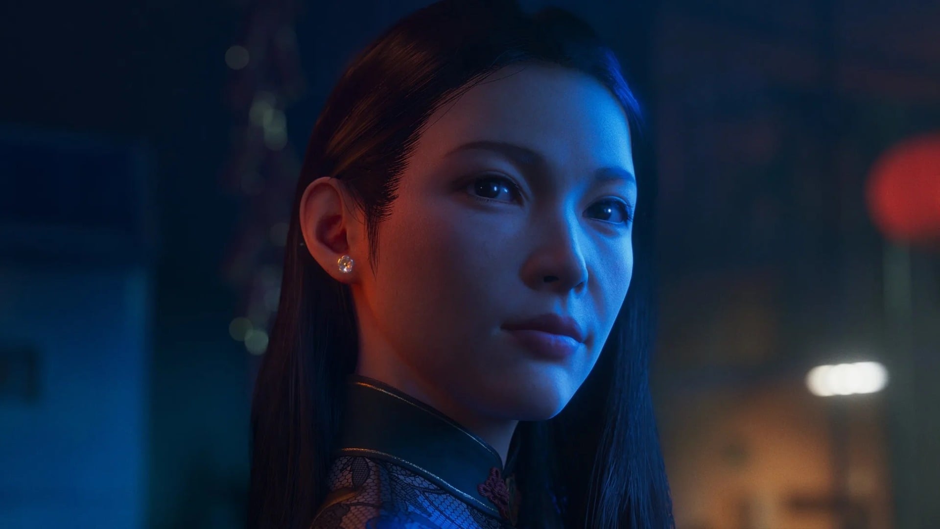 A woman stands in the night.