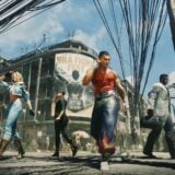 Fighters line up outside on a street.