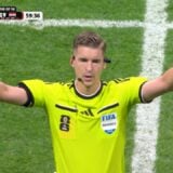 A referee makes the sign for VAR.