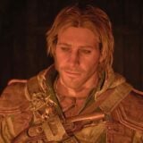 Edward looks sad by a fire.
