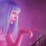 A hologram reaches out to a man.