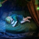 Link sleeps in a bed.