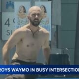 Man destroys Waymo at busy intersection.