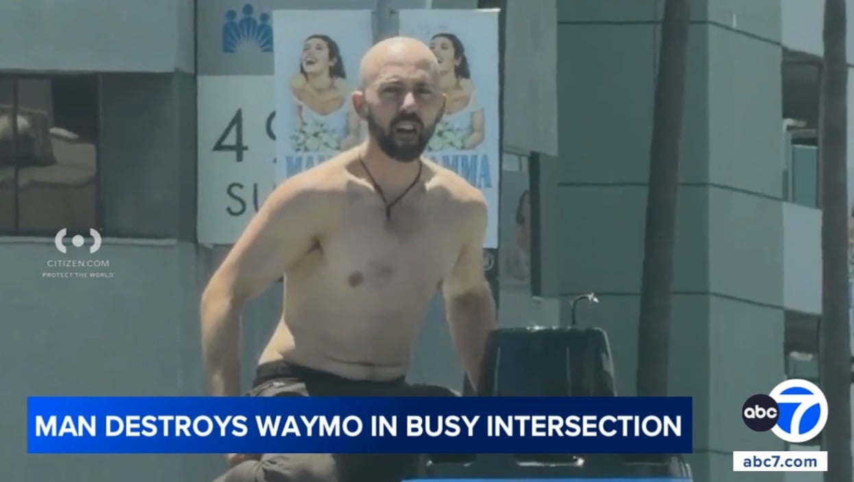 Man destroys Waymo at busy intersection.