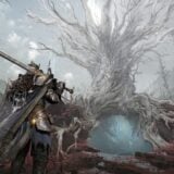A warrior stands beneath a grey tree.