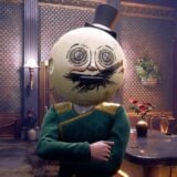 A man in a moon helmet is distressed.