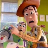 Woody and Bud Lightyear hug each other in terror.