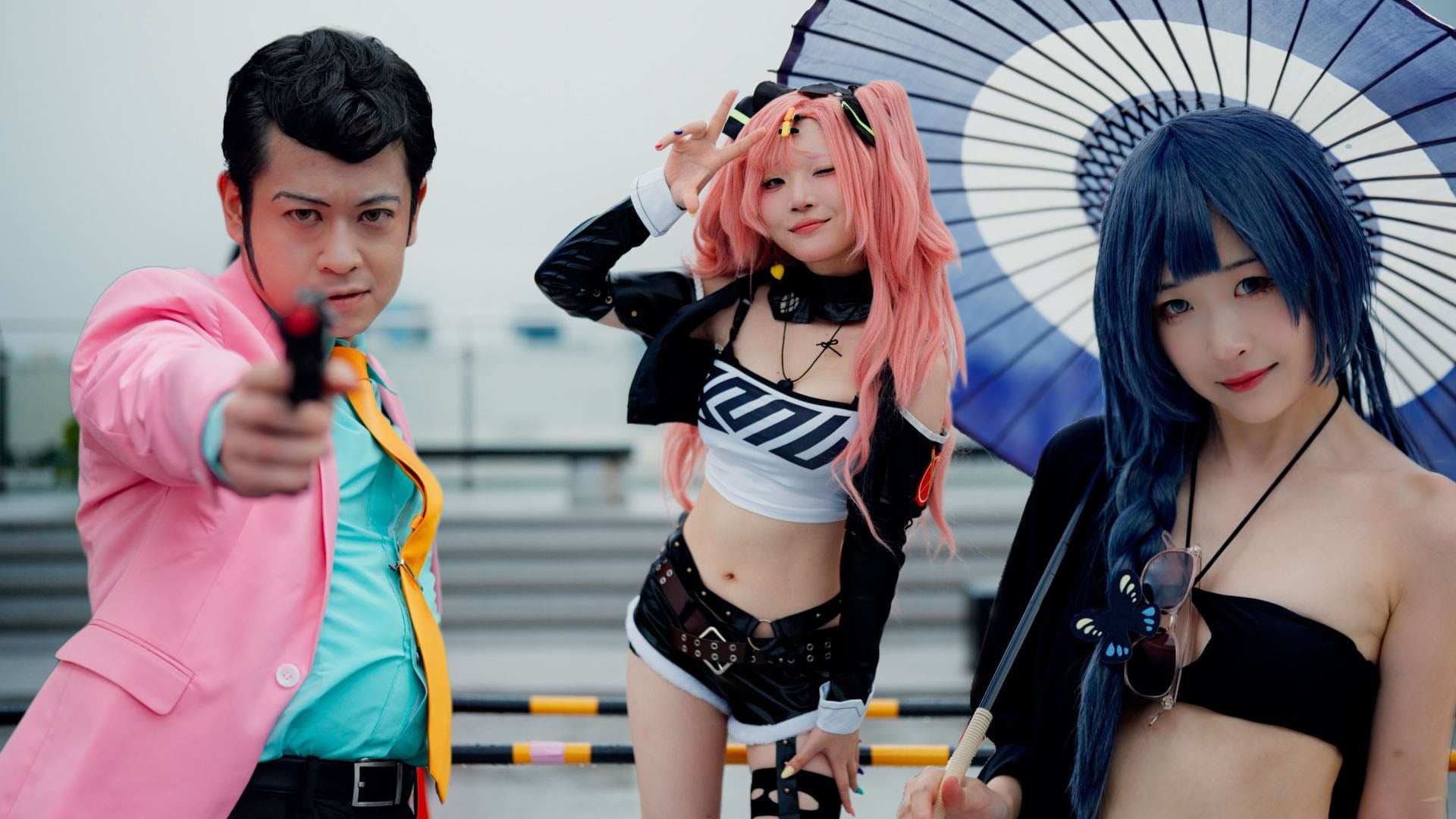 Three cosplayers at Comiket 2026