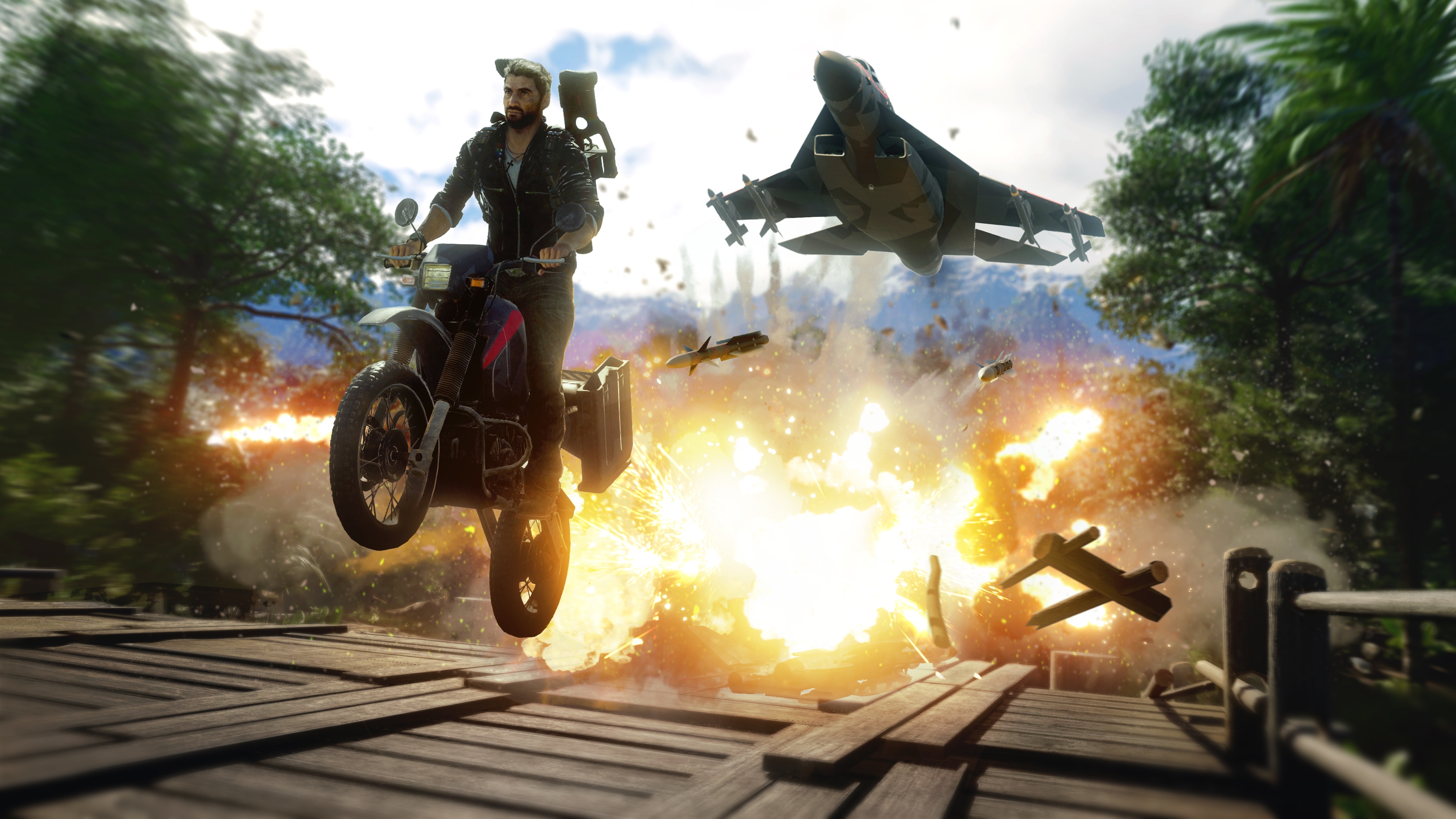 Just Cause 4 action screenshot: Rico on a bike with an explosion and a jet