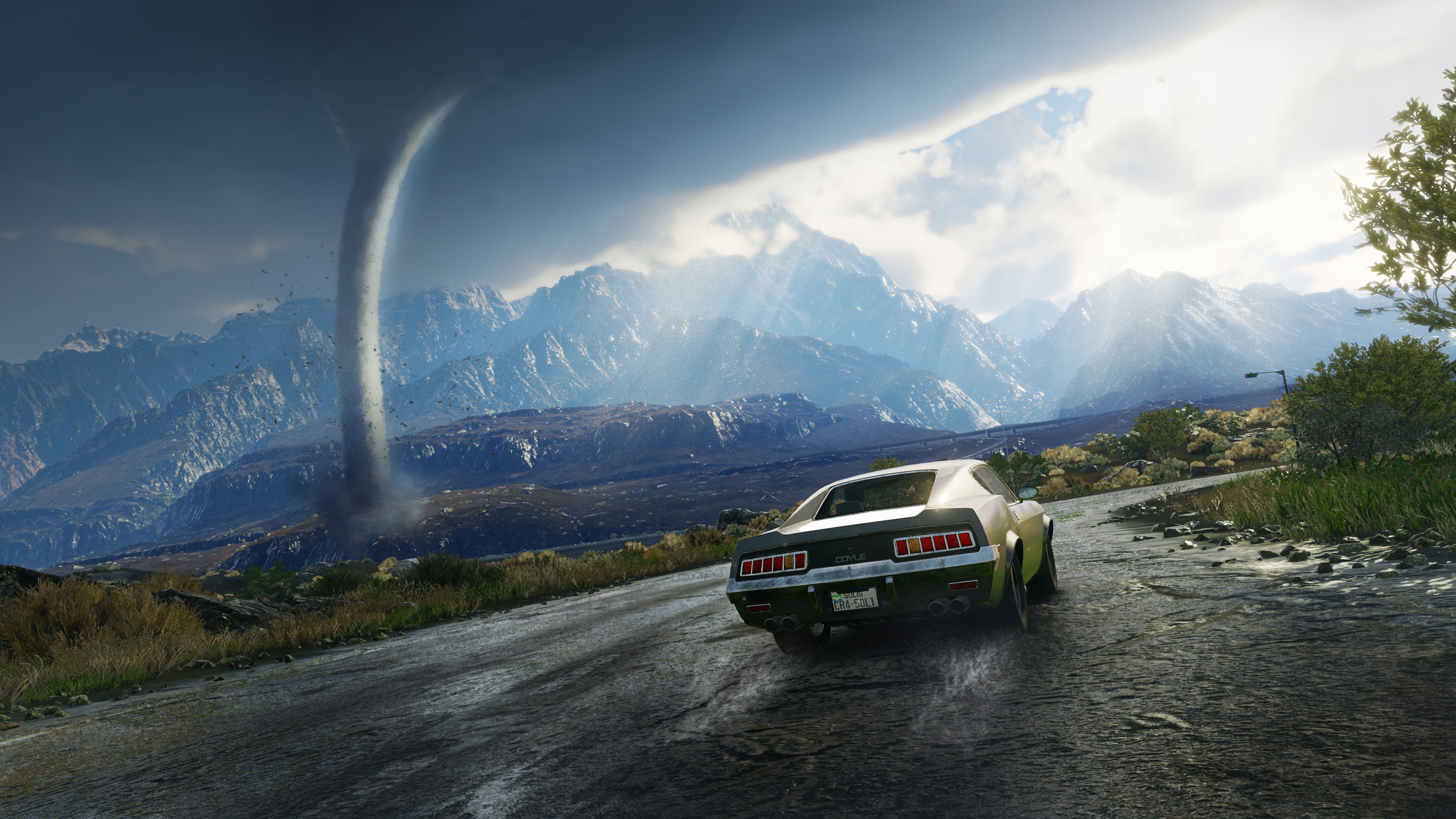 Just Cause 4 gameplay screenshot: car on a wet road with a tornado